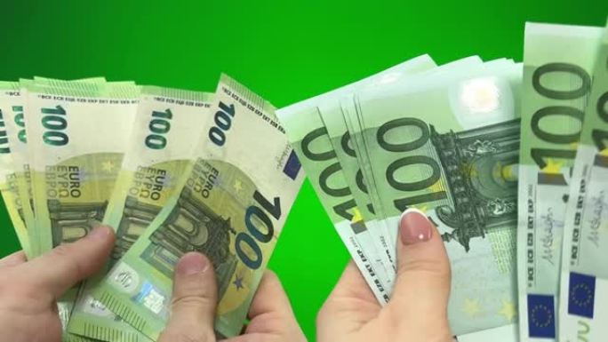 将旧100欧元纸币换成新男人的手计数女人的旧钞票换成新的绿色背景色度关键业务购买买房公寓旅行旅行