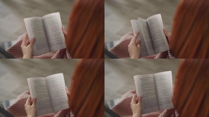 红发女人翻阅书页用英语阅读故事