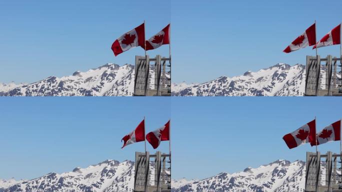 加拿大国旗随风在加拿大惠斯勒黑梳圆屋旅馆移动