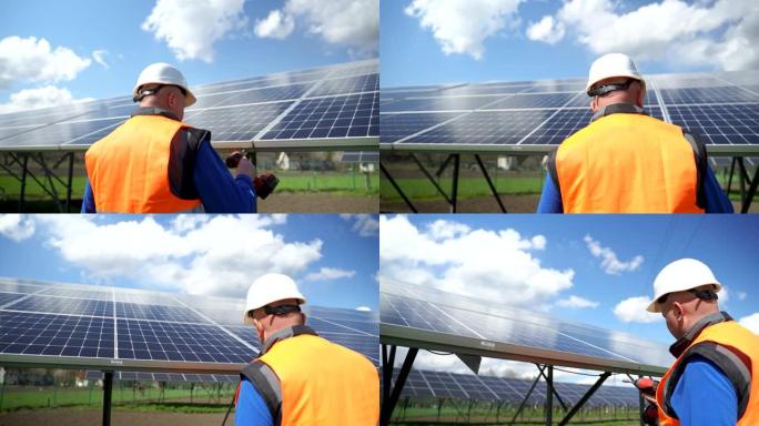 穿着特殊制服和防护头盔的男工人在太阳能电池板上固定。替代能源的维修和保养。