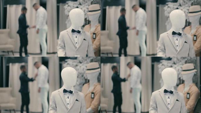 新郎在一家男士优雅的服装店组织起来并为婚礼打扮