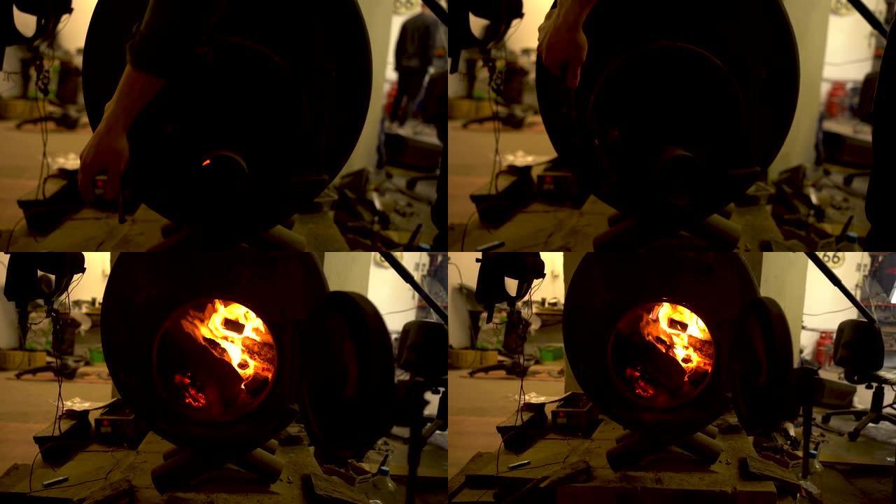 木柴在金属炉子里燃烧，一个人打开炉子的门。