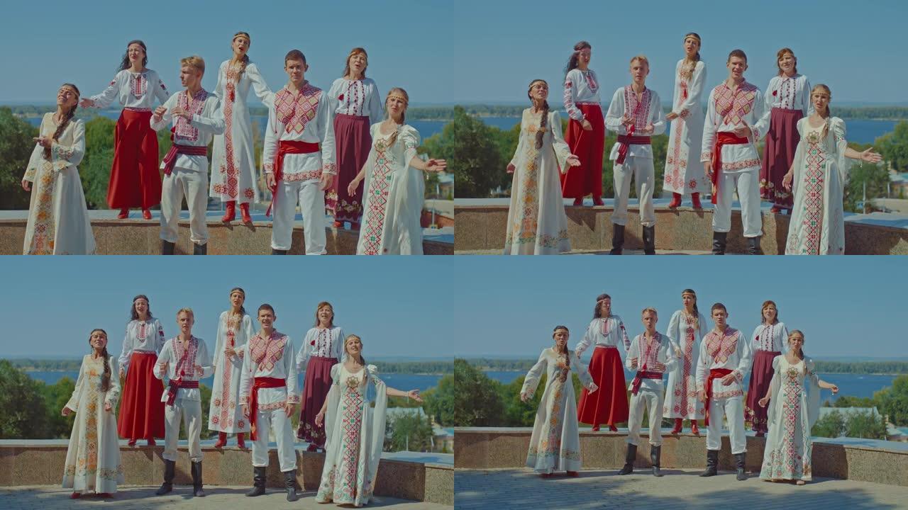 美丽的乌克兰男女在山上唱歌，他们穿着民族服装和刺绣服装。乌克兰人民享受生活，在公园里唱歌，幸福的生活