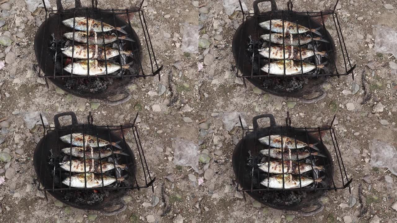 在椰子壳煤上燃烧的烤鱼的制作过程