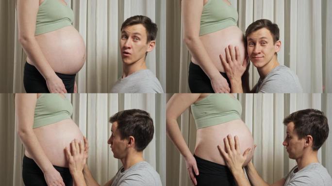 年轻的父亲惊讶地发现婴儿在怀孕的肚子里移动