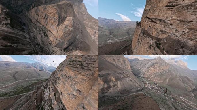 飞鹰跟随山石结构沙漠谷村乡村景观鸟瞰图