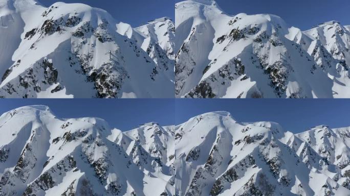 雪山飞离煤气管石坡岩土如画的冬季景观鸟瞰图