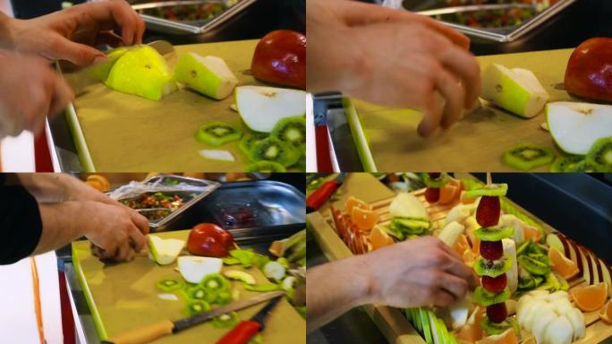 厨师准备水果沙拉盘的特写视图。
