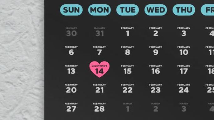 日历2022的美丽黑色2月页面的特写镜头，相机移至标有粉红色心形符号的情人节