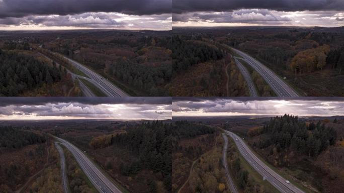 冬季有云和太阳光线的高速公路反向无人机超脱