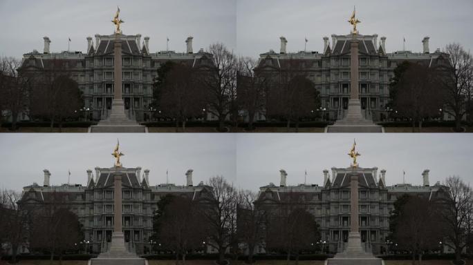 在一个阴郁的日子里，华盛顿特区的艾森豪威尔行政办公大楼和第一师纪念碑