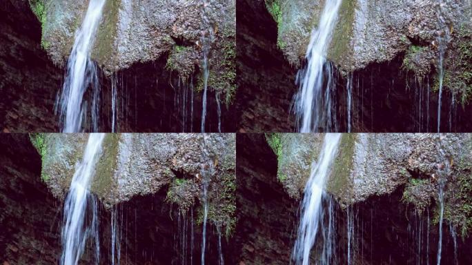 美丽的可循环瀑布背景特写，4k自然的放松水流声