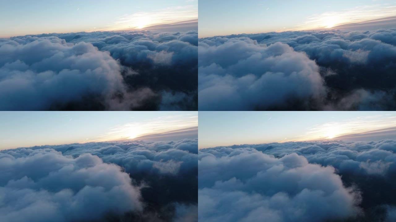 空中无人机在日出前拍摄了带有山峰的云海