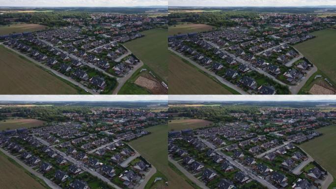 具有现代住宅郊区社区的欧洲小城市的鸟瞰图