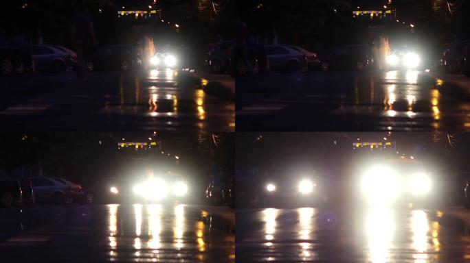 5月的一个晚上，在一个小镇的街道上短暂下雨后，汽车和行人交通94