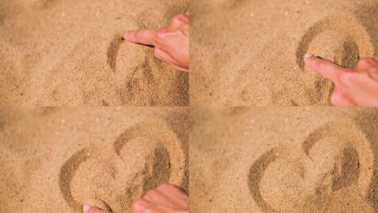 用手指在沙滩上画一颗心，是对海滩度假的热爱。海滩上的热黄色易碎沙子-海岸，度假村。