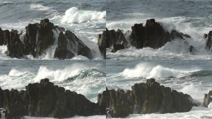 大浪撞击海洋中的岩石南非甘斯拜