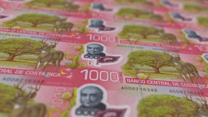 哥斯达黎加冒号印刷机打印出当前冒号钞票，无缝循环，哥斯达黎加货币货币背景，4K，聚焦深度Smoot和