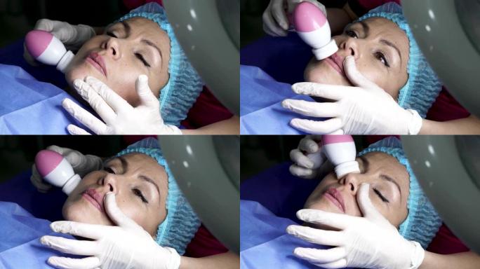 一名拉丁妇女在水疗中心接受美容治疗，医生将用医学元素测量她面部的长度和宽度