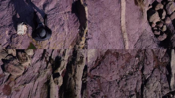 牡蛎湾，托贝，德文郡: 无人机鸟瞰图，孤立的人，岩层和沉积断层线