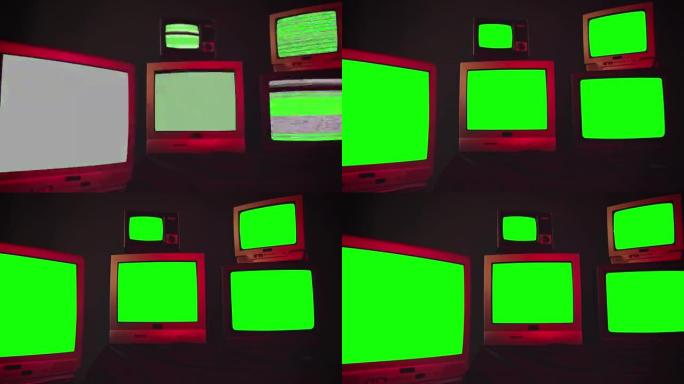 一组5台老式电视，带色度键屏幕，房间内有蓝色黑色墙壁