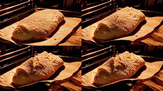 厨房烤箱自制有机面包烘烤。新鲜的恰巴塔。面包被抬高了