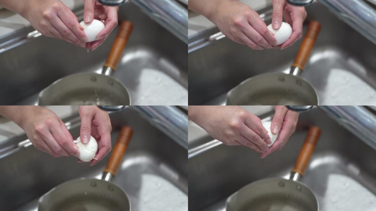 女人剥煮鸡蛋