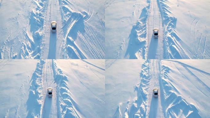 跟随一辆在雪道上行驶的白色汽车。