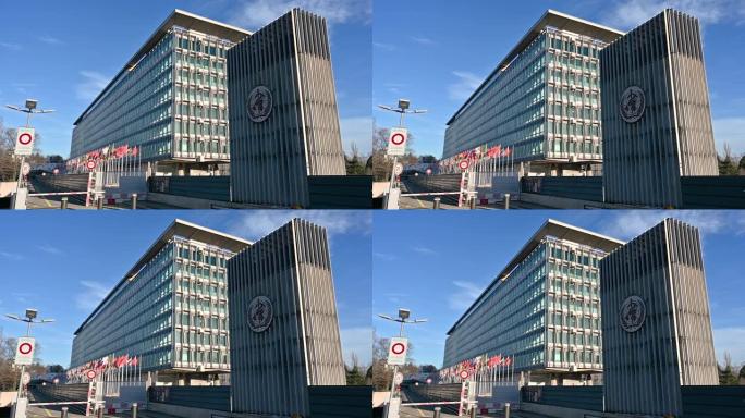 2023年1月，瑞士日内瓦。这是联合国总部的漂亮慢镜头。在右边的标志明显，在左边的旗帜缓缓飘扬。阳光