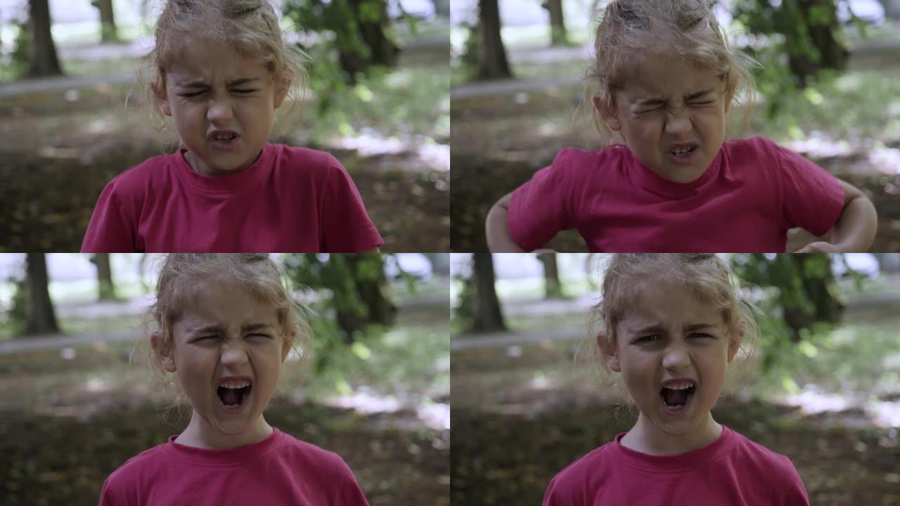 震惊、愤怒和情绪激动的小女孩的肖像。年轻愤怒的女孩尖叫着慢动作。心烦意乱的孩子大声尖叫。Adhd注意