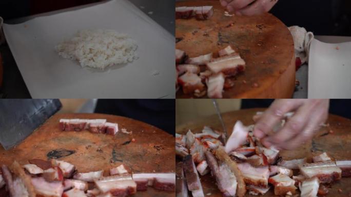 厨师正在将美味的脆皮猪肉和烤叉烧红猪肉切在圆形的旧木砧板上。