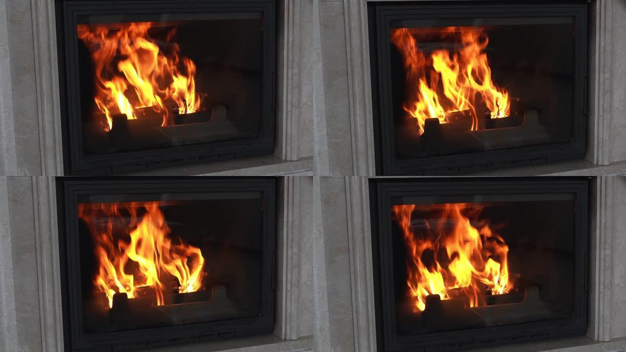 时尚的铸铁壁炉，带壁炉，家庭内部内衬大理石石材。现代火炉用火烧木头装饰和加热房子。橙色的火焰舌头在防