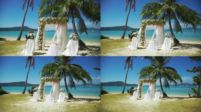 婚礼设置拱形花椅仪式海滩。