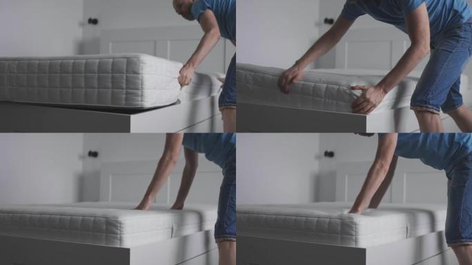 那人给他的卧室买了新床垫。主人把床垫放在床上，检查它的质量