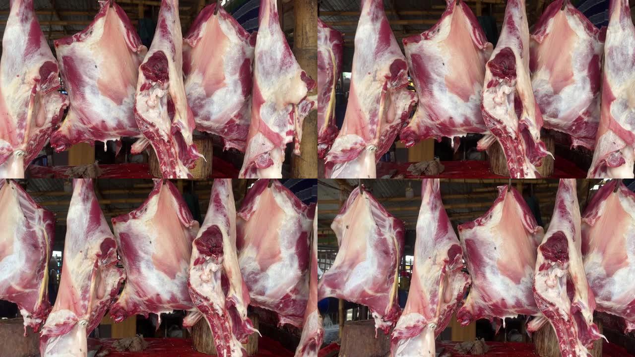 山羊肉悬挂在户外农贸市场出售