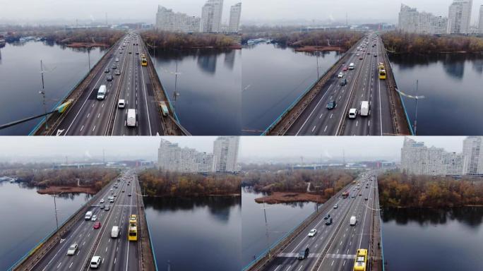 空中无人驾驶飞机以空中飞行的城市景观穿过桥梁的钢绳墩