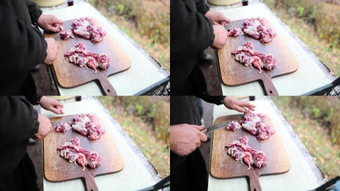 男性手切生羊肉排骨烧烤