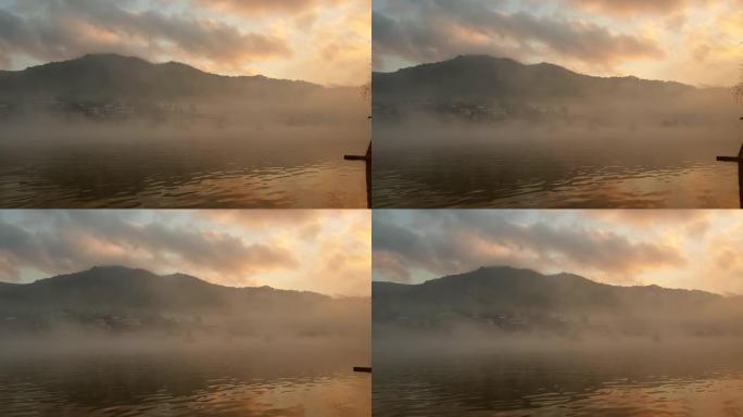 泰国湄宏顺雾之城。美丽的日出和湖上的移动雾在慢动作中折腾