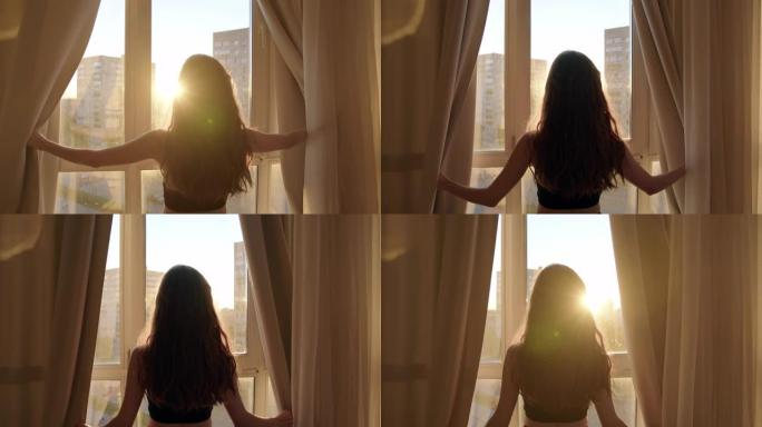 苗条性感的黑色上衣女孩到达酒店，打开窗帘从肮脏的雨窗，夕阳照进来。年轻的女旅行者打开全景玻璃窗上的织