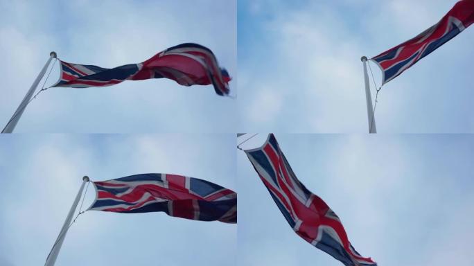 4k低角度镜头英国国旗在蓝天下在风中挥舞