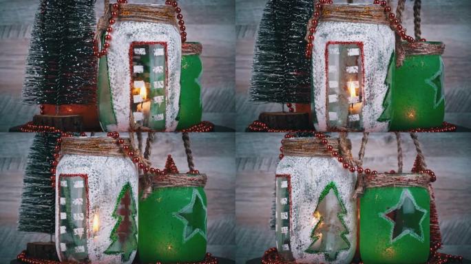 用蜡烛和圣诞树旋转在雪地上装饰圣诞罐