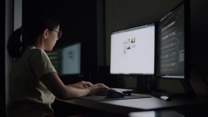 坦率的亚洲女性深夜工作强调了家庭办公室电脑上的一个问题。