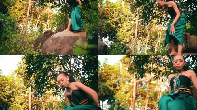 一名亚洲妇女在森林中央穿着绿色衣服和化妆时表情愤怒地接近某人