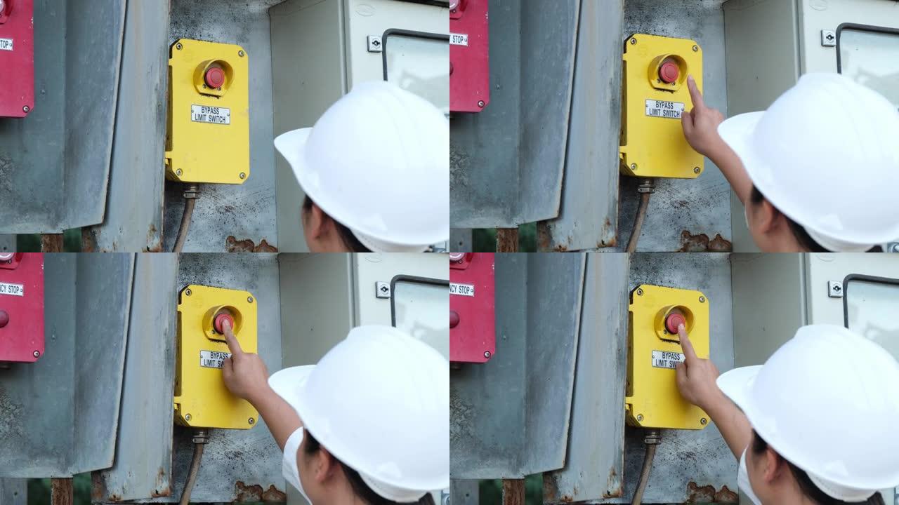 专业亚洲电气工程师打开开关的肖像。