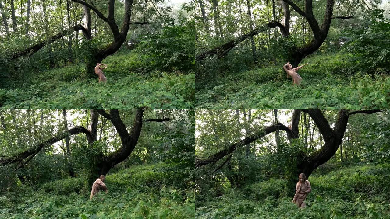 穿着乡村服装的女孩在森林中即兴表演神秘的舞蹈