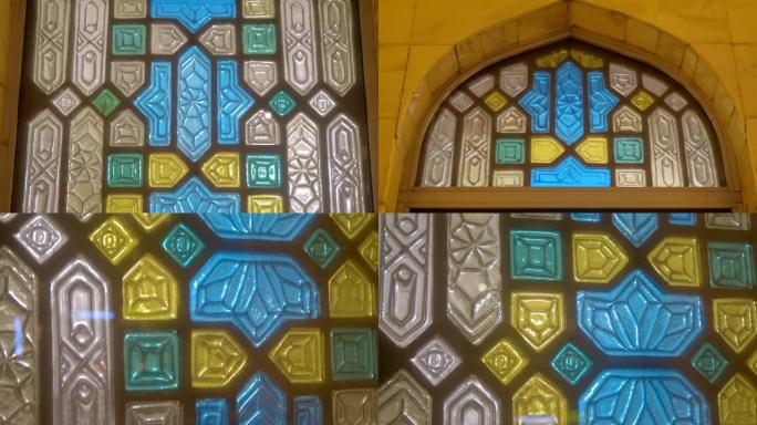 在中央清真寺的墙壁上，美丽的拱形窗户和彩色的装饰品