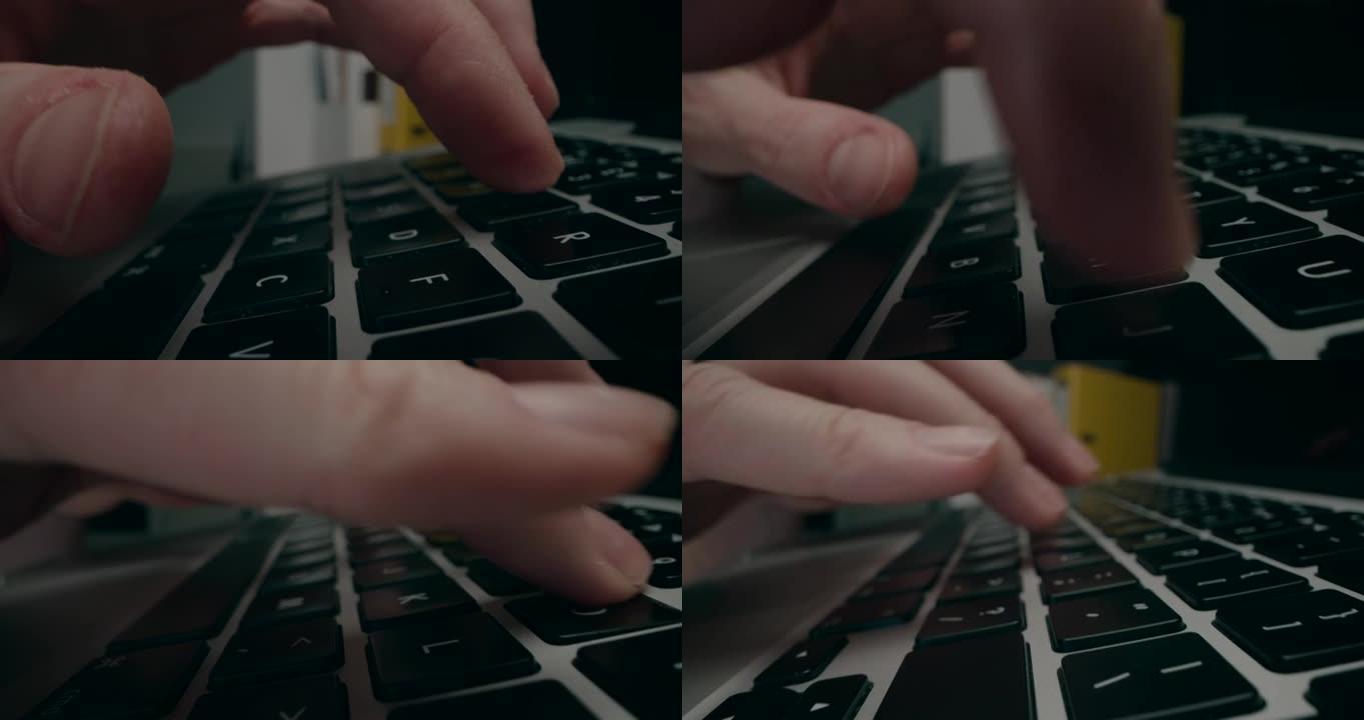 男子手指打字笔记本电脑键盘的特写滑动镜头。
