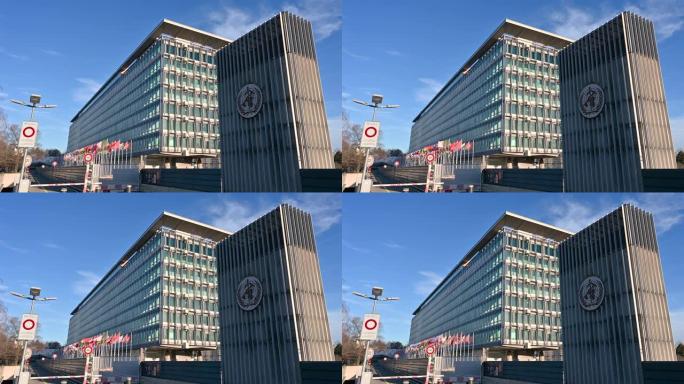 2023年1月，瑞士日内瓦。联合国总部的漂亮镜头。在右边的标志明显，在左边的旗帜缓缓飘扬。阳光明媚的