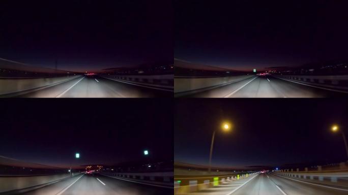 黎明前在高速公路上行驶的汽车的景色