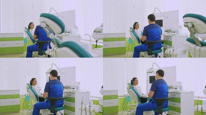 阿拉伯牙医告诉妇女坐在牙科椅上的病人有关卫生的信息。口腔的综合治疗。医学与健康